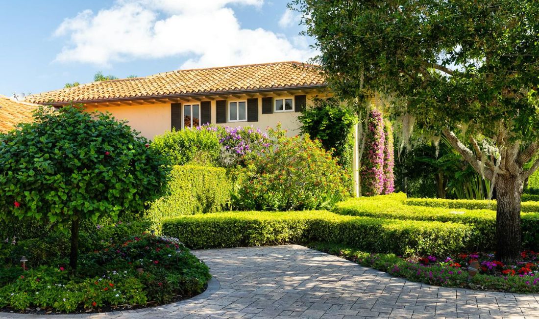 Coastal Gardens maintained property with properly pruned trees. 