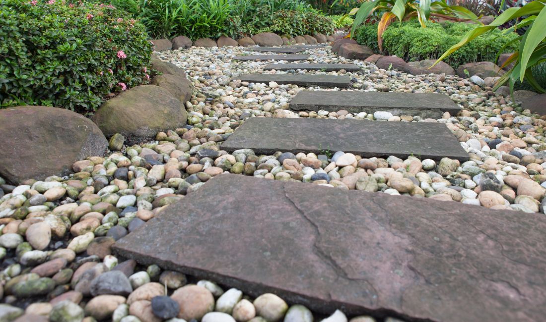 A gravel pathway with stepping stones at a Palm Beach home.